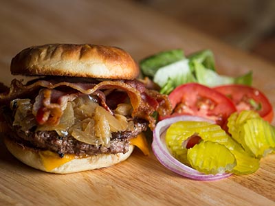 The Roadhouse's burger with bacon, onions and cheese, pictured with fresh toppings