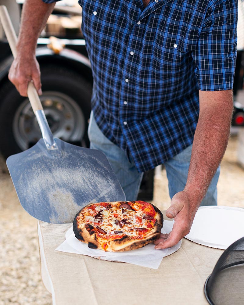 A freshly baked Gavin Farms pizza served from the Roadhouse's portable wood-fired oven